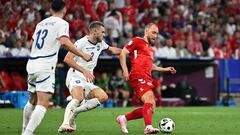 Denmark's midfielder #10 Christian Eriksen (R)  fights for the ball with Serbia's defender #02 Strahinja Pavlovic during the UEFA Euro 2024 Group C football match between Denmark and Serbia at the Munich Football Arena in Munich on June 25, 2024. (Photo by MIGUEL MEDINA / AFP)