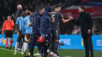 England's defender #05 John Stones leaves the pitch after being injured during the International friendly football match between England and Belgium at Wembley stadium, in London, on March 26, 2024. (Photo by Glyn KIRK / AFP) / NOT FOR MARKETING OR ADVERTISING USE / RESTRICTED TO EDITORIAL USE