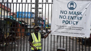 A security man stands at the main gate of Computer Village, the largest Information and Communications Technology  accessories market in African continent, to prevent access to the market in compliance with the extended lockdown by the government as measu