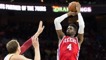 Nov 2, 2015; Philadelphia, PA, USA; Philadelphia 76ers center Nerlens Noel (4) scores past Cleveland Cavaliers center Timofey Mozgov (20) during the first quarter at Wells Fargo Center. Mandatory Credit: Bill Streicher-USA TODAY Sports