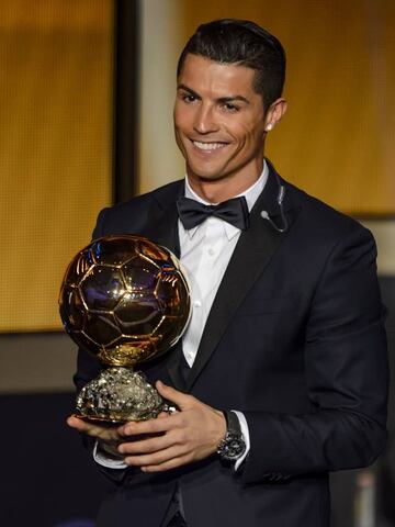 Real Madrid and Portugal forward Cristiano Ronaldo smiles after receiving the 2014 FIFA Ballon d'Or award.