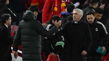 Liverpool's German manager Jurgen Klopp and Real Madrid's Italian coach Carlo Ancelotti shake hands at the end of the UEFA Champions League last 16 first leg football match between Liverpool and Real Madrid at Anfield in Liverpool, north west England on February 21, 2023. - Real Madrid won 5-2. (Photo by Paul ELLIS / AFP)
