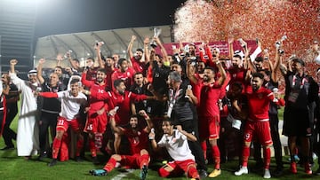 Soccer Football - Gulf Cup - Final - Bahrain v Saudi Arabia - Abdullah bin Khalifa Stadium, Doha, Qatar - December 8, 2019  Bahrain players and coaching staff celebrate winning the Gulf Cup after the match  REUTERS/Ibraheem Al Omari