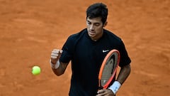 Chile's Christian Garin reacts during his 2023 ATP Tour Madrid Open tennis tournament singles match against US' Taylor Fritz at the Caja Magica in Madrid on May 1, 2023. (Photo by OSCAR DEL POZO / AFP)