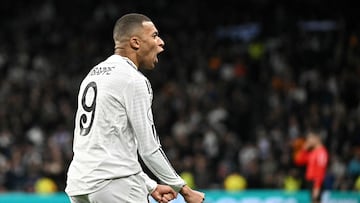 Real Madrid's French forward #09 Kylian Mbappe celebrates scoring his team's first goal during the Spanish Copa del Rey (King's Cup) last 16 first leg football match between Real Madrid CF and RC Celta de Vigo at the Santiago Bernabeu stadium in Madrid on January 16, 2025. (Photo by JAVIER SORIANO / AFP)