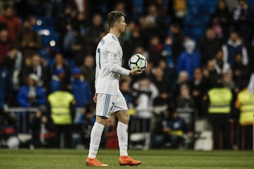 Cristiano Ronaldo takes the souvenir ball after scoring four goals.