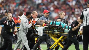 The wide receiver was carried off on a stretcher after taking a blow to the head. The game was stopped for 12 minutes while he received attention.