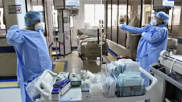 BOGOTA, COLOMBIA - AUGUST 28: Health workers get ready with their personal protective equipment (PPE) to treat a patient with Covid-19 in the Intensive Care Unit at de La Samaritana University Hospital on August 28, 2020 in Bogota, Colombia. According to 