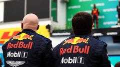 BUDAPEST, HUNGARY - JULY 19: Red Bull racing team members look on as Second placed Max Verstappen of Netherlands and Red Bull Racing celebrates on the podium during the Formula One Grand Prix of Hungary at Hungaroring on July 19, 2020 in Budapest, Hungary. (Photo by Bryn Lennon/Getty Images)