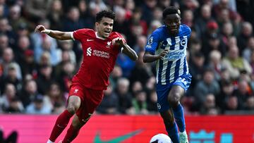 Liverpool's Colombian midfielder #07 Luis Diaz (L) fights for the ball with Brighton's Ivorian midfielder #24 Simon Adingra during the English Premier League football match between Liverpool and Brighton and Hove Albion at Anfield in Liverpool, north west England on March 31, 2024. (Photo by Paul ELLIS / AFP) / RESTRICTED TO EDITORIAL USE. No use with unauthorized audio, video, data, fixture lists, club/league logos or 'live' services. Online in-match use limited to 120 images. An additional 40 images may be used in extra time. No video emulation. Social media in-match use limited to 120 images. An additional 40 images may be used in extra time. No use in betting publications, games or single club/league/player publications. / 