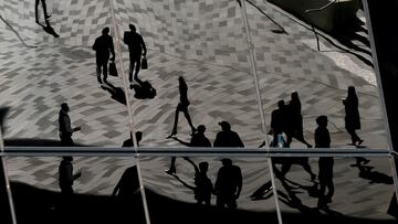FILE PHOTO: Workers are reflected in an office building's windows in Sydney's Barangaroo business district in Australia's largest city, May 8, 2017. REUTERS/Jason Reed//File Photo