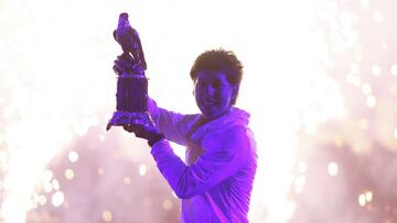 Carla Suarez Navarro of Spain holds the trophy after winning her women's final match against Jelena Ostapenko of Latvia at the Qatar Open tennis tournament, in Doha February 27, 2016.