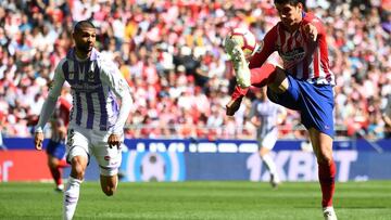 Atletico Madrid's Spanish forward Alvaro Morata (R) challenges Real Valladolid's Spanish defender Joaquin during the Spanish League football match between Atletico Madrid and Real Valladolid at the Wanda Metropolitan stadium in Madrid on April 2