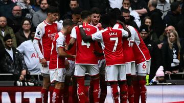 Arsenal's players celebrate following the own goal scored by Tottenham Hotspur's Danish midfielder #05 Pierre-Emile Hojbjerg during the English Premier League football match between Tottenham Hotspur and Arsenal at the Tottenham Hotspur Stadium in London, on April 28, 2024. (Photo by Ben Stansall / AFP) / RESTRICTED TO EDITORIAL USE. No use with unauthorized audio, video, data, fixture lists, club/league logos or 'live' services. Online in-match use limited to 120 images. An additional 40 images may be used in extra time. No video emulation. Social media in-match use limited to 120 images. An additional 40 images may be used in extra time. No use in betting publications, games or single club/league/player publications. / 