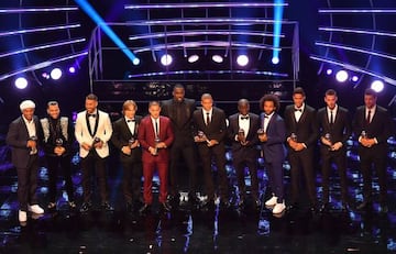 (L-R) Presenter Ronaldinho, Dani Alves, Sergio Ramos, Luka Modric, Eden Hazard, host Idris Elba, Kylian Mbappe N'Golo Kante, Marcelo, Raphael Varane, David De Gea and presenter Michael Ballack.