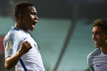 England's forward Dominic Calvert-Lewin congratulates teammate Ademola Lookman.