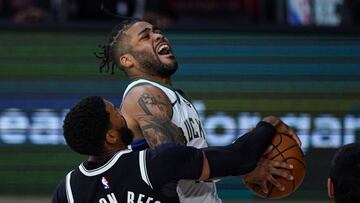 Aug 4, 2020; Lake Buena Vista, USA; Milwaukee Bucks guard Frank Mason III (15) is fouled as he shoots by Brooklyn Nets guard Garrett Temple (17) during the second half of an NBA basketball game Tuesday, Aug. 4, 2020 in Lake Buena Vista, Fla. Mandatory Credit: Ashley Landis/Pool Photo via USA TODAY Sports