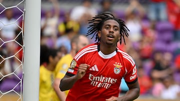 A storm stopped play at half-time before Benfica began the rout of Auckland City.