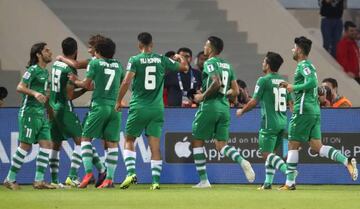 Iraq's players celebrate their goal during the 2019 AFC Asian Cup group D football match between Yemen and Iraq at Sharjah stadium in Sharjah on January 12, 2019.