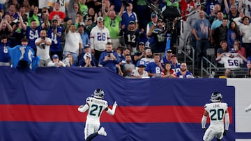 Seattle Seahawks cornerback Devon Witherspoon (21) celebrates his interception for a touchdown during the third quarter against the New York Giants at MetLife Stadium.