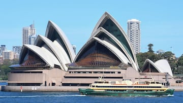 SYDNEY, AUSTRALIA - APRIL 05: A Sydney Manly ferry with very few people onboard passing the Sydney Opera House on April 05, 2020 in Sydney, Australia. The Australian government has introduced further restrictions on movement and gatherings in response to 