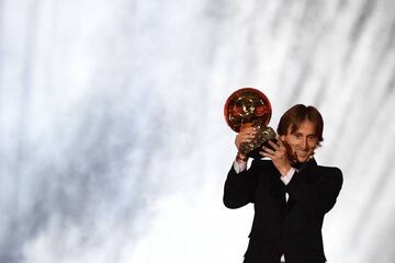 Luka Modric holds the Ballon d'Or trophy aloft at Monday's gala in Paris.