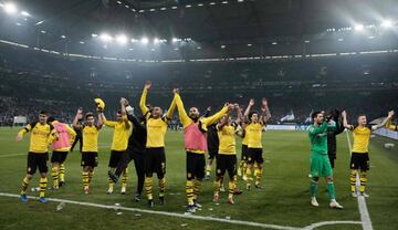 Dortmund's players react after the German first division Bundesliga football match Schalke 04 vs Borussia Dortmund