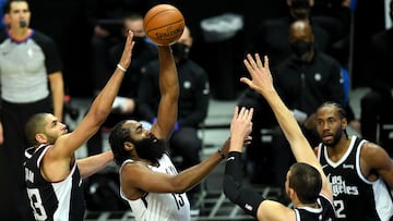 Feb 21, 2021; Los Angeles, California, USA; Brooklyn Nets guard James Harden (13) shoots defended by Los Angeles Clippers forward Nicolas Batum (33) and center Ivica Zubac (40) as he drives to the basket in the first half of the game at Staples Center. Mandatory Credit: Jayne Kamin-Oncea-USA TODAY Sports