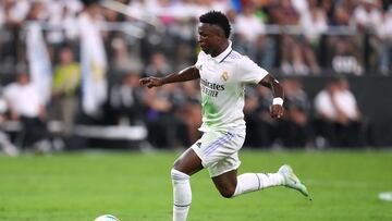 Jul 23, 2022; Las Vegas, Nevada, USA; Real Madrid forward Vinicius Jose Paixao (20) kicks the ball ahead against Barcelona during a game at Allegiant Stadium. Mandatory Credit: Stephen R. Sylvanie-USA TODAY Sports