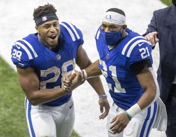 Jonathan Taylor #28 and Nyheim Hines #21 of the Indianapolis Colts celebrate after the Colts defeated the Jacksonville Jaguars to earn a spot in the NFL Play-Offs at Lucas Oil Stadium on January 3.