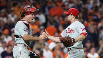 Oct 28, 2022; Houston, Texas, USA; Philadelphia Phillies relief pitcher David Robertson (30) and catcher J.T. Realmuto (left) celebrate on the field after defeating the Houston Astros during game one of the 2022 World Series at Minute Maid Park. Mandatory Credit: Erik Williams-USA TODAY Sports