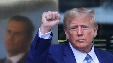 FILE PHOTO: Former U.S. President Donald Trump gestures as he departs from Trump Tower to give a deposition to New York Attorney General Letitia James who sued Trump and his Trump Organization, in New York City, U.S., April 13, 2023. REUTERS/Mike Segar/File Photo