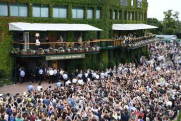 Serena Williams of The United States lifts the trophy infront of the fans from The Members balcony following victory in The Ladies Singles Final against Angelique Kerber of Germany on day twelve of the Wimbledon Lawn Tennis Championships at the All Englan