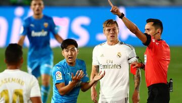 Soccer Football - La Liga Santander - Real Madrid v Valencia - Alfredo Di Stefano Stadium, Madrid, Spain - June 18, 2020 Valencia's Lee Kang-in is shown a red card by referee Jose Maria Sanchez as play resumes behind closed doors following the outb
