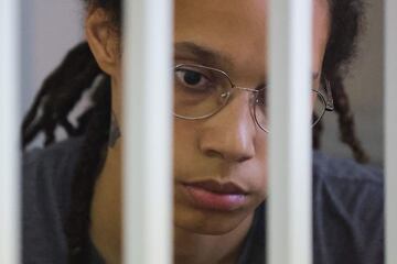 In this file photo taken on August 04, 2022 US' Women's National Basketball Association (WNBA) basketball player Brittney Griner, who was detained at Moscow's Sheremetyevo airport and later charged with illegal possession of cannabis, waits for the verdict inside a defendants' cage during a hearing in Khimki outside Moscow. - Brittney Griner, who was found guilty of drug possession and trafficking in Russia, has appealed her nine-year jail sentence, her lawyers said on August 15, 2022.