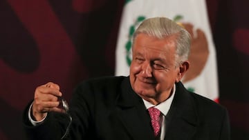 Mexico's President Andres Manuel Lopez Obrador holds his watch before handing it to the winner after it was raffled to members of the media during his last press conference, at the National Palace, in Mexico City, Mexico September 30, 2024. REUTERS/Henry Romero