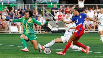 Jul 16, 2024; Washington, D.C., USA; Costa Rica goalkeeper Noeila Bermudez (1) makes a save on United States forward Mallory Swanson (9) as Costa Rica defender Gabriela Guillen (2) defends in the first half of a send0off friendly at Audi Field. Mandatory Credit: Geoff Burke-USA TODAY Sports