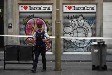 A police officer patrols on Las Ramblas following yesterday's terrorist attack, on August 18, 2017.