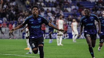Strasbourg's Brzilian midtielder Andrey Santos reacts after scoring his team' second goal during the French L1 football match between Olympique Lyonnais (OL) and Strasbourg (RCSA) at The Groupama Stadium in Decines-Charpieu, central-eastern France on August 30, 2024. (Photo by Thibaud MORITZ / AFP)