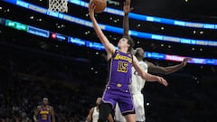 Jan 19, 2024; Los Angeles, California, USA; Los Angeles Lakers guard Austin Reaves (15) shoots the ball against Brooklyn Nets forward Dorian Finney-Smith (28) in the first half at Crypto.com Arena. Mandatory Credit: Kirby Lee-USA TODAY Sports