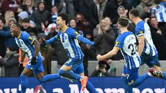 Brighton's Japanese midfielder Kaoru Mitoma (C) celebrates with reserves after scoring their second goal during the English FA Cup fourth round football match between Brighton & Hove Albion and Liverpool at the Amex stadium in Brighton, on the south coast of England on January 29, 2023. - Brighton won the game 2-1. (Photo by Glyn KIRK / AFP) / RESTRICTED TO EDITORIAL USE. No use with unauthorized audio, video, data, fixture lists, club/league logos or 'live' services. Online in-match use limited to 120 images. An additional 40 images may be used in extra time. No video emulation. Social media in-match use limited to 120 images. An additional 40 images may be used in extra time. No use in betting publications, games or single club/league/player publications. / 