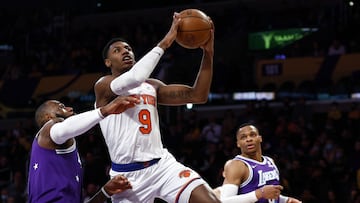 LOS ANGELES, CALIFORNIA - FEBRUARY 05: RJ Barrett #9 of the New York Knicks takes a shot against LeBron James #6 of the Los Angeles Lakers in the first quarter at Crypto.com Arena on February 05, 2022 in Los Angeles, California. NOTE TO USER: User expressly acknowledges and agrees that, by downloading and/or using this Photograph, user is consenting to the terms and conditions of the Getty Images License Agreement.   Ronald Martinez/Getty Images/AFP
== FOR NEWSPAPERS, INTERNET, TELCOS & TELEVISION USE ONLY ==