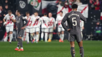 Real Madrid's English midfielder #05 Jude Bellingham reacts after Rayo Vallecano's Spanish forward #07 Isi Palazon scored their third goal during the Spanish league football match between Rayo Vallecano de Madrid and Real Madrid CF at the Vallecas stadium in Madrid on December 14, 2024. (Photo by Pierre-Philippe MARCOU / AFP)