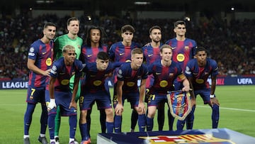 Barcelona players pose before the UEFA Champions League league phase day 2 football match between FC Barcelona and Paris Saint-Germain (PSG) at the Estadi Olimpic Lluis Companys in Barcelona, on October 1, 2025. (Photo by Lluis GENE / AFP)