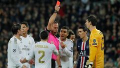 Soccer Football - Champions League - Group A - Real Madrid v Paris St Germain - Santiago Bernabeu, Madrid, Spain - November 26, 2019  Real Madrid&#039;s Thibaut Courtois is shown a red card by referee Artur Soares Dias before the decision is reversed foll