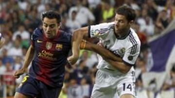 Xavi Hernández y Xabi Alonso, dos de los elegidos por los lectores de L'Equipe.
