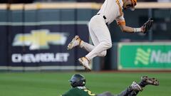 HOUSTON, TEXAS - MARCH 05: Jorel Ortega #2 of the Tennessee Volunteers leaps over a sliding Jack Pineda #2 of the Baylor Bears into second base in the second inning during the Shriners Children&#039;s College Classic at Minute Maid Park on March 05, 2022 