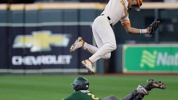 HOUSTON, TEXAS - MARCH 05: Jorel Ortega #2 of the Tennessee Volunteers leaps over a sliding Jack Pineda #2 of the Baylor Bears into second base in the second inning during the Shriners Children&#039;s College Classic at Minute Maid Park on March 05, 2022 