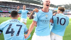 MANCHESTER, ENGLAND - OCTOBER 02: Erling Haaland of Manchester City celebrates as team mate Phil Foden scores their sides first goal during the Premier League match between Manchester City and Manchester United at Etihad Stadium on October 02, 2022 in Manchester, England. (Photo by Matt McNulty - Manchester City/Manchester City FC via Getty Images)