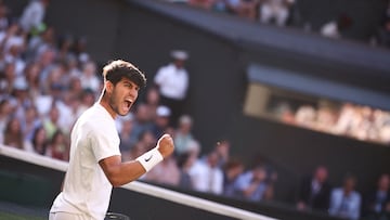 Spain's Carlos Alcaraz celebrates after winning against Britain's Cameron Norrie during their men's singles quarter-final tennis match on the ninth day of the 2025 Wimbledon Championships at The All England Lawn Tennis and Croquet Club in Wimbledon, southwest London, on July 8, 2025. (Photo by HENRY NICHOLLS / AFP) / RESTRICTED TO EDITORIAL USE